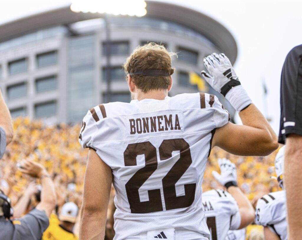 Photo on Boone Bonnema waving to a children's hospital.